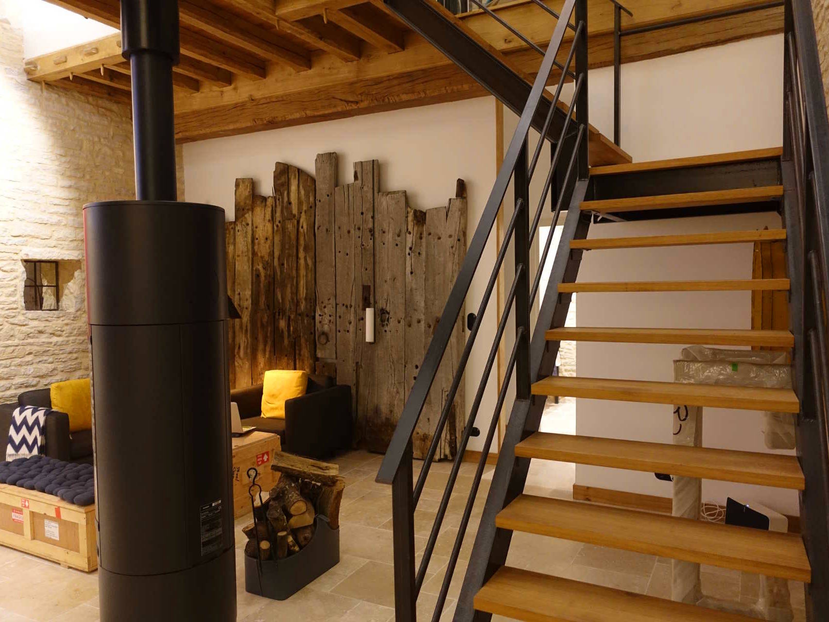 15th century barn conversion living area and stair to upper bedroom lofts