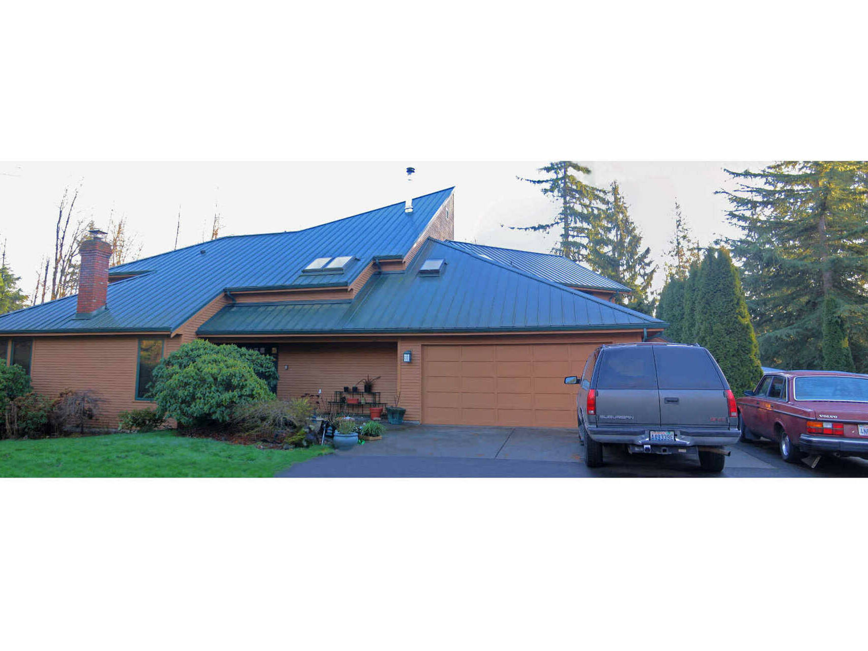 entry view of single level house with new second floor addition